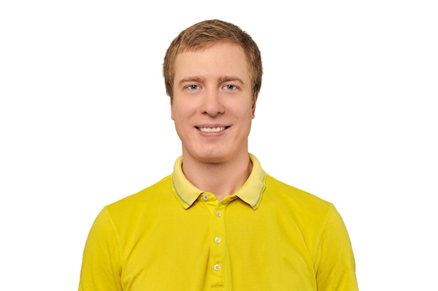 Portrait of funny young male in yellow Tshirt isolated on white background handsome happy man