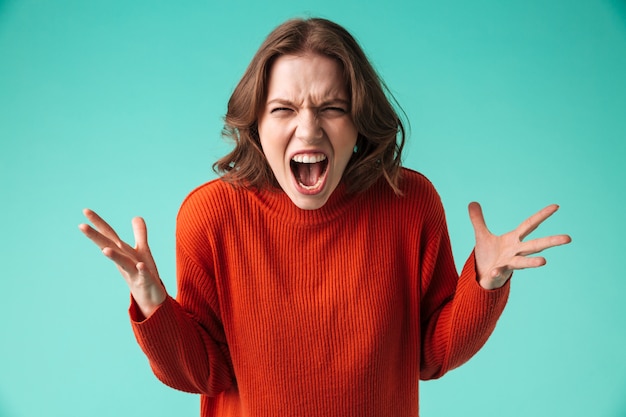 Photo portrait of a furious young woman dressed in sweater