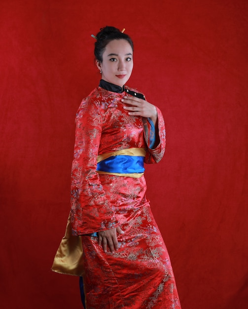 portrait of a geisha girl on a red background