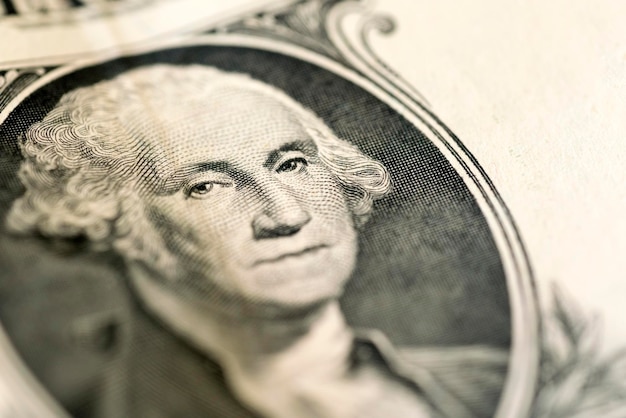 Photo portrait of george washington on 1 dollar bill closeup