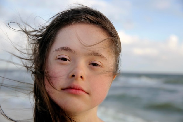 Portrait of the girl on background of the sea