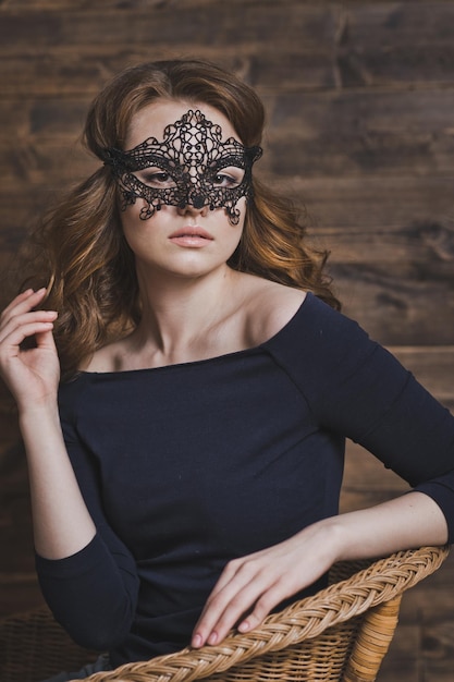 Portrait of a girl in a black masquerade mask 5970