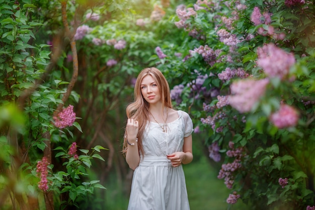 portrait of a girl in a blooming garden