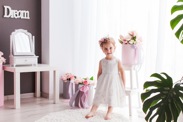 Portrait of girl in a bright girly room
