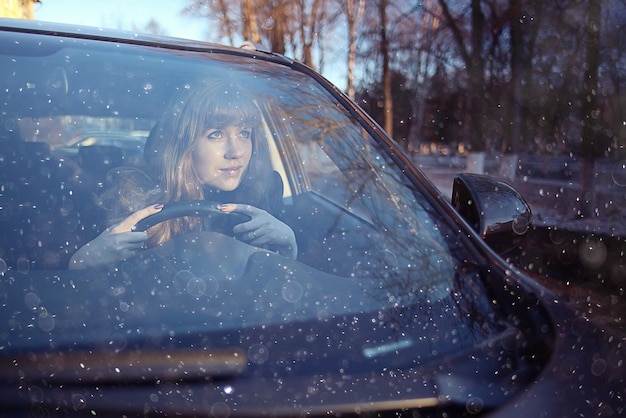 portrait of a girl in a car driver at the wheel