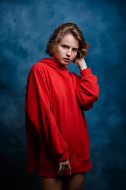 Portrait of a girl closeup on a blue background