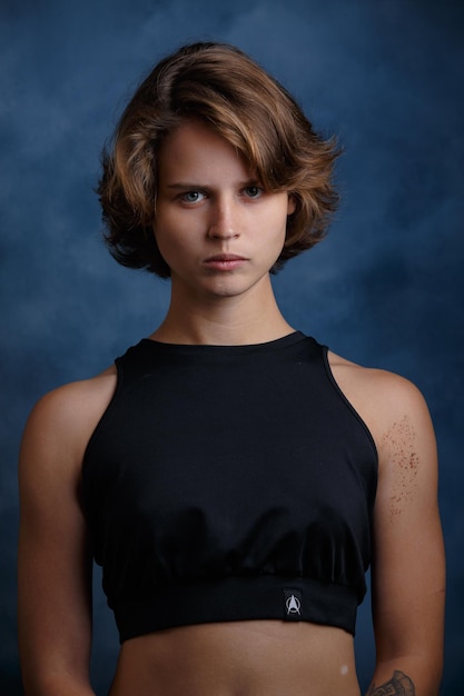 Portrait of a girl closeup on a blue background