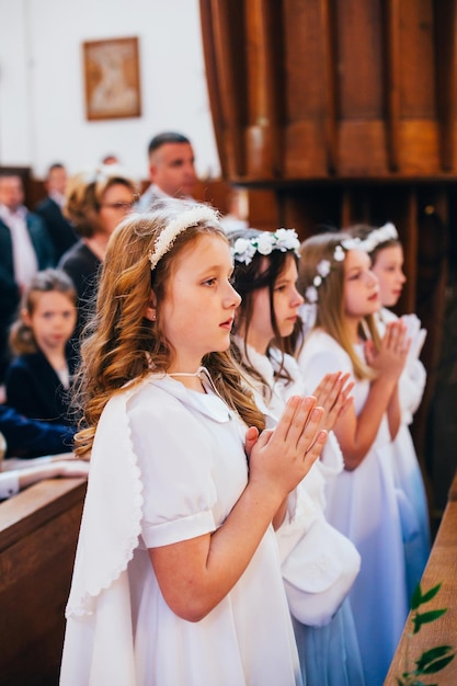 Portrait of a girl during the communion prayer