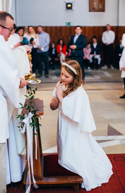 Portrait of a girl during the communion prayer