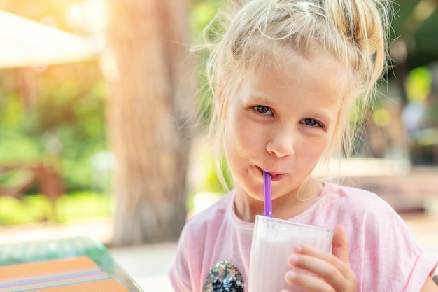 Portrait of girl drinking glass