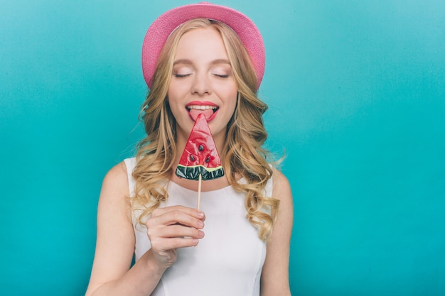 Portrait of a girl eating a lollipop