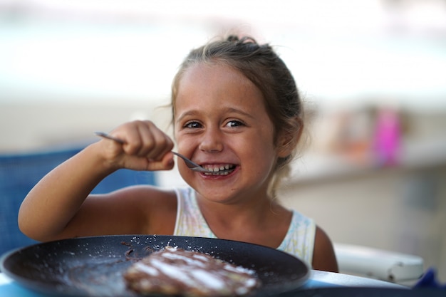 Portrait of a girl eating