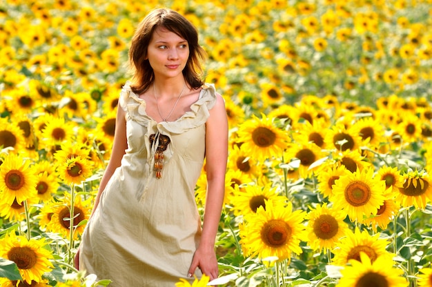 Portrait of girl in field of sunflowers