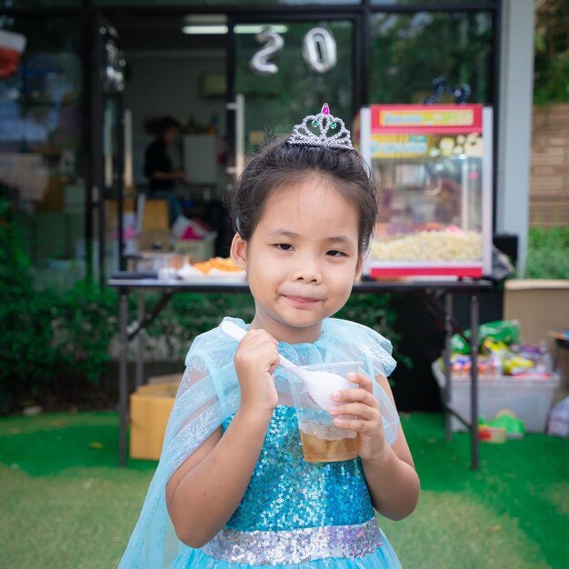 Portrait of girl having food