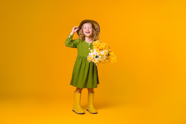 Portrait of a girl holding a bouquet of flowers