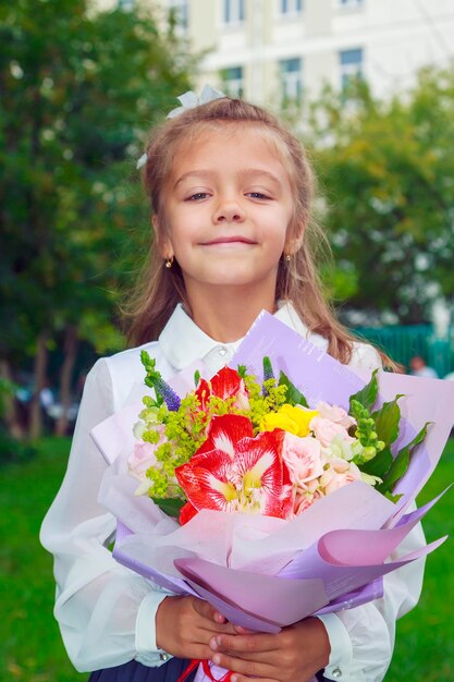 Portrait of girl holding flower bouquet