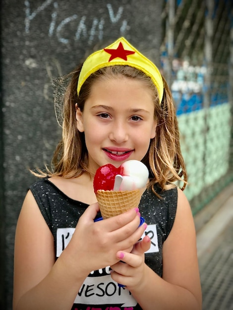 Portrait of girl holding ice cream