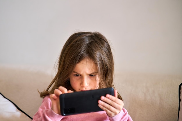 portrait of girl holding mobile phone