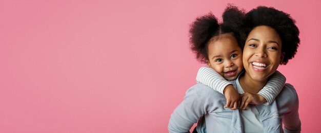 Photo portrait of girl hugging her mother with lovely smile on a pink background