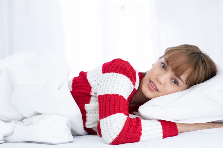 Photo 躺在床上的女孩的肖像