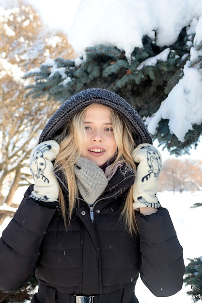 Portrait of a girl in nature in winter