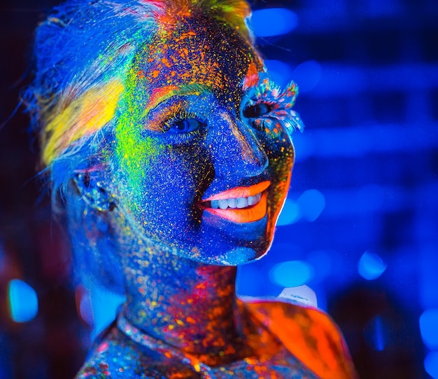 Portrait of a girl painted in fluorescent powder.