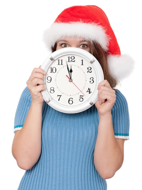 Portrait of a girl in Santa hat with clock on white background