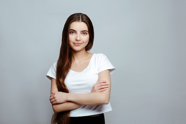 Portrait of a girl smiling on a white background