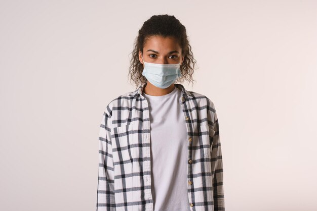 Portrait of girl standing against white background