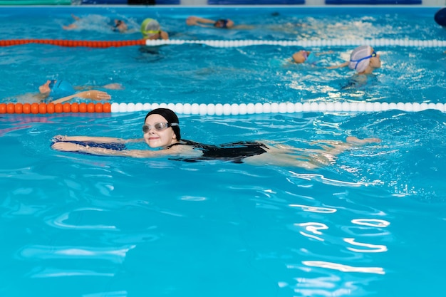 Portrait of girl swimming in pool