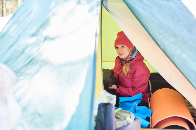 Portrait of a girl tourists in tents