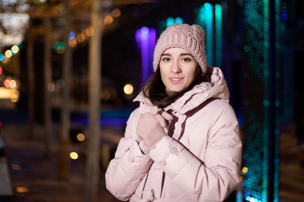 Portrait of a girl walking in a night park