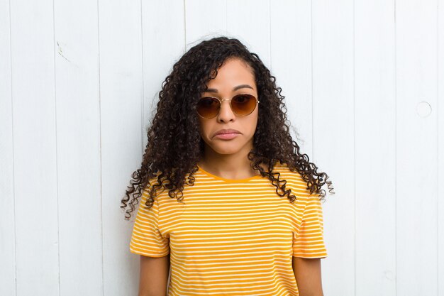 portrait of a girl on a white wooden background