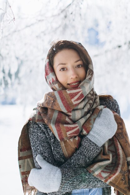 A portrait of a girl with a beautiful smile in the winter.