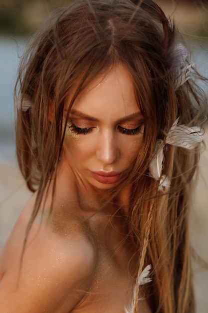 Portrait of a girl with beautiful summer make-up and dreadlocks