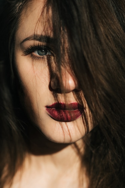 portrait of a girl with disheveled hair and red lipstick