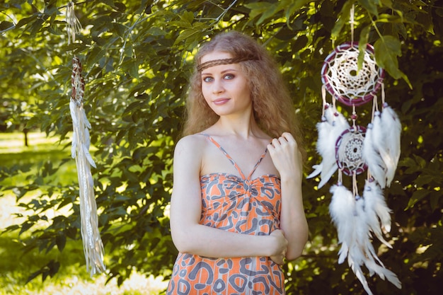 Portrait of Girl with Dreamctahcer Hanging Alongside