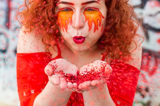 Portrait of a girl with a fiery makeup