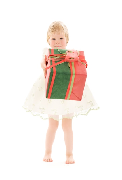 portrait of girl with gift box over white wall