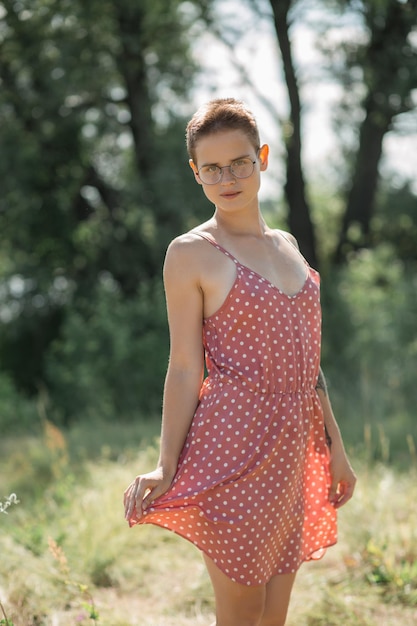 Portrait of a girl with glasses, close-up, female face, hair cutting, pleasant feelings