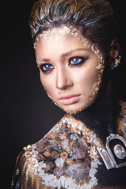 Portrait a girl with Golden icon painting makeup