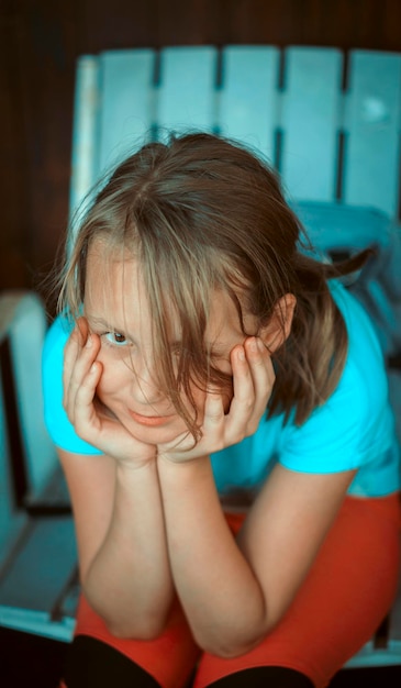 Portrait of girl with head in hands