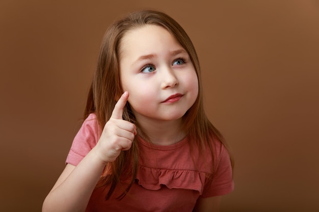 Portrait of a girl with a pensive pose showing eureka