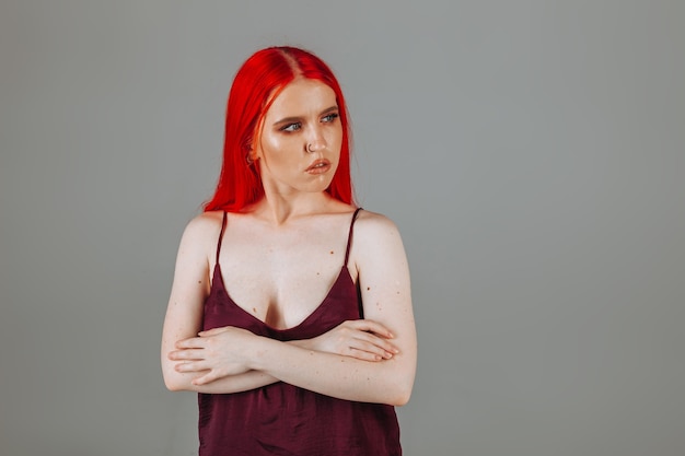 Portrait of a girl with red long hair