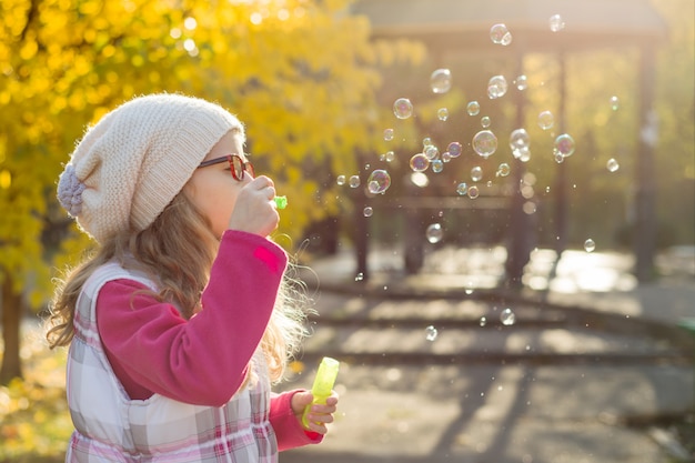 Portrait of girl with soap bubbles