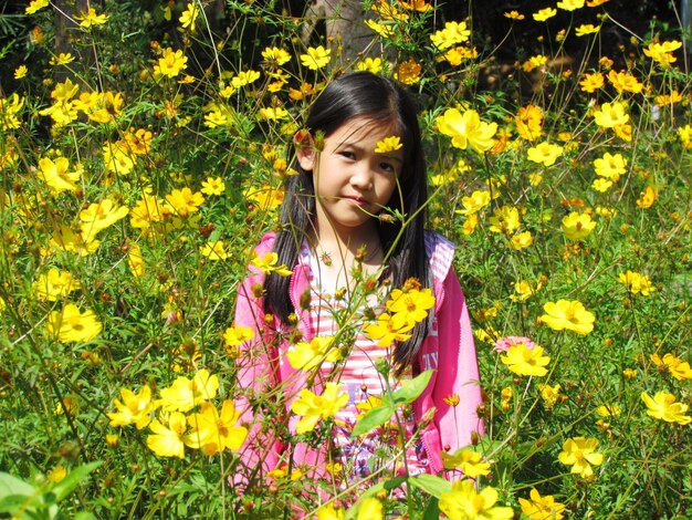 Portrait of girl with yellow flowers