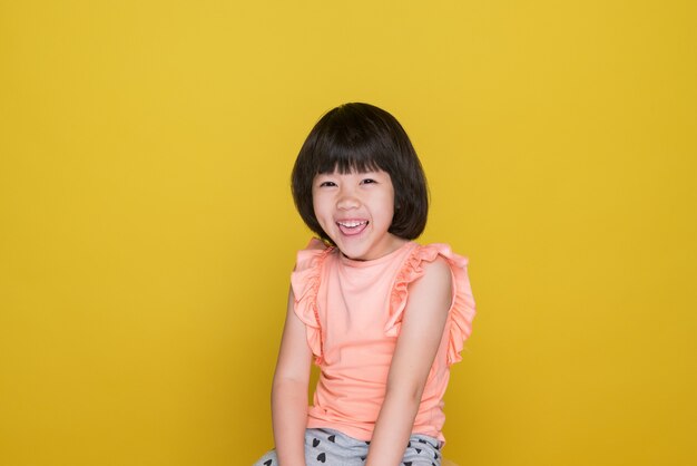 Portrait girl on yellow background asian woman