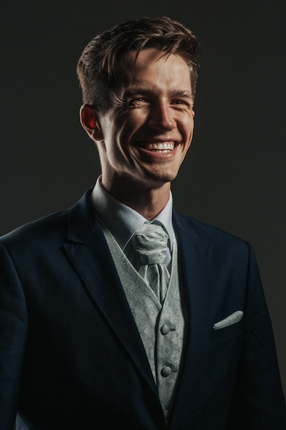 portrait of good-looking businessman with awesome smile dressed in a suit