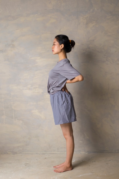 Portrait of gorgeous young Asian woman practicing yoga