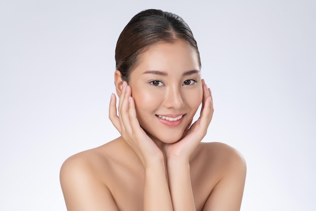 Portrait of gorgeous young girl posing beauty gesture with clean fresh skin